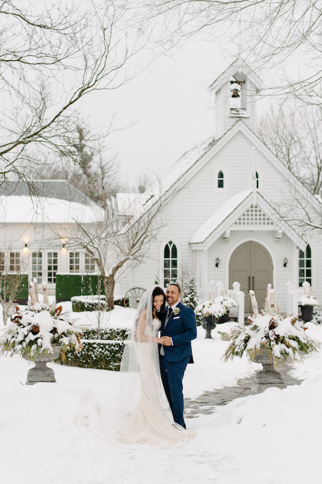 Bride and Groom taking winter wedding portraits The Doctor's House